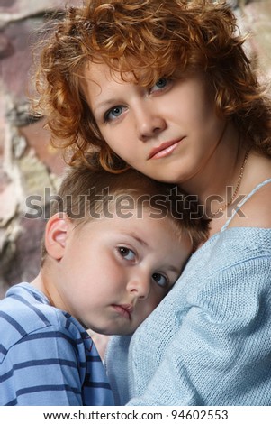 a sad portrait of mother and son