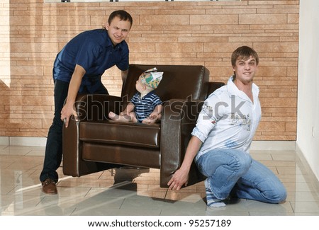little boy on a leather couch