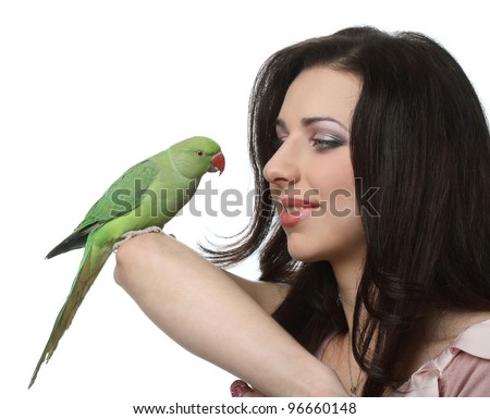 stock photo : beautiful green parrots play with the Trainers