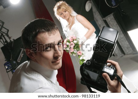 portrait of the newlyweds on studio shooting