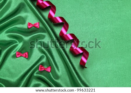 luxurious green satin with a bows and ribbon