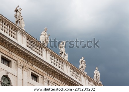 balustrade architectural monument with sculptures on the background of the sky before the storm