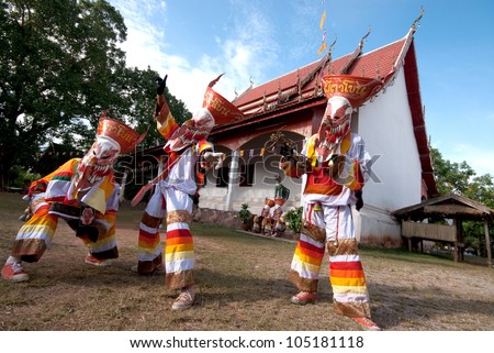 LOEI, THAILAND - JULY 1: Unidentified young people dress in spirit and wear a mask, sing and dance  Phi Ta Khon Festival ( Ghost mask festival ) on July 1, 2011 in Loei, Thailand.