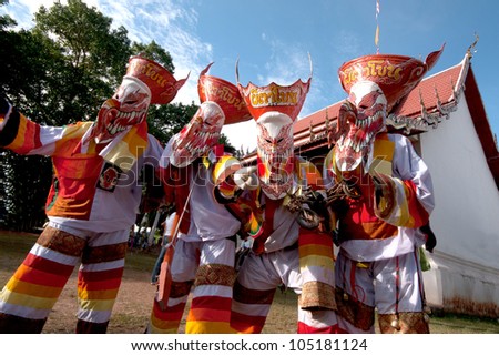 LOEI, THAILAND - JULY 1: Unidentified young people dress in spirit and wear a mask, sing and dance  Phi Ta Khon Festival ( Ghost mask festival ) on July 1, 2011 in Loei, Thailand.