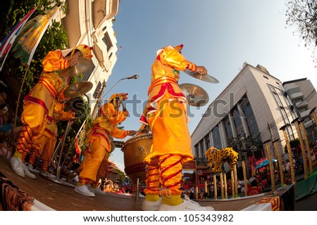 BANGKOK- THAILAND-JANUARY 24: Chinese Lion jumping on the Mei flower poles in Chinese New Year Festival on January 24, 2012 in Bangkok. It hesitates for further jumping or going back.