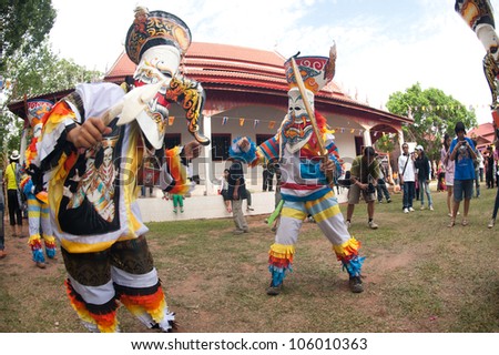 LOEI, THAILAND - JUNE 23: Phi Ta Khon Festival ( Traditional ghost mask festival ) Young people dress in spirit and wear a mask, sing and dance  on June 23,2012 in Loei Province,Thailand.