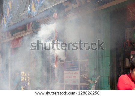 NAKHONSAWAN, THAILAND - FEB 13: Fire caused by firecrackers at Chinese Traditions And Customs during the Chinese New Year celebrations on February 13, 2013 in Nakhonsawan city,Middle of Thailand.