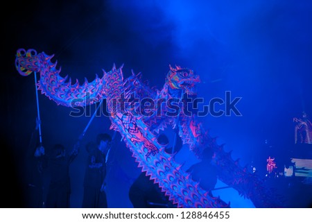 SUPUNBURI, THAILAND - FEBRUARY 10 : Group Parade of Golden dragon show light and sound at during the Chinese New Year celebrations on February 10, 2013 in Supunburi Province, Middle of Thailand.