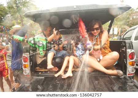 AYUTTAYA, THAILAND - APRIL 15: Thai people enjoy splashing water together in songkran festival ( water festival or New year day ) on April 15, 2013 in Ayuttaya ancient city, Middle of Thailand.