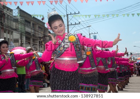 YASOTHON,THAILAND - MAY 11 : Unidentified woman traditional dancing on parades in Rocket festival. The celebration for plentiful rains during the rice plant season,on May11,2013 in Yasothon,Thailand.