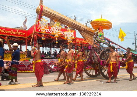 YASOTHON,THAILAND-MAY 11: Ancient rocket with cart on parades showing in Rocket festival. The celebration for plentiful rains during the rice plant season,on May11,2013 in Yasothon,Thailand.