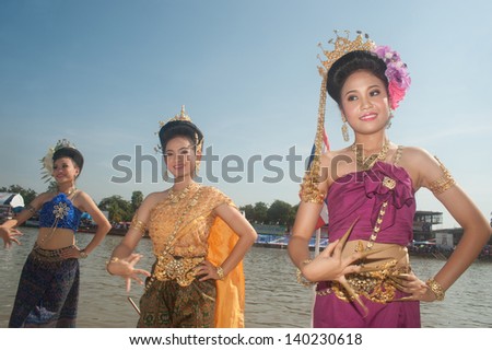 NAKHONRATCHASIMA ,THAILAND-NOV  10 : Unidentified Thai dancing is inaugurated boat race during King\'s Cup Native Long Boat Race Championship on November 10, 2012 in NakhonRatchasima,Thailand .