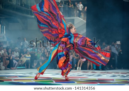 BANGKOK,THAILAND-APRIL 20 : A member of the Dutch group Teatro Pavana performs Venetian style stilt show dancing and enjoy at the Siam center department store on April 20,2013 in Bangkok,Thailand.