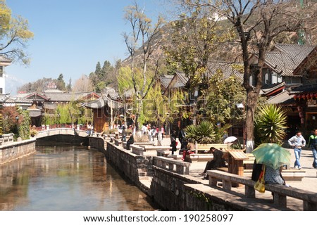 LIJIANG,CHINA Ã¢Â?Â? MARCH 17 : Crowd travel walking on Dayan old town streets on March 17, 2014 in Lijiang city,Dayan old town was inscribed on the UNESCO World Heritage List in 1997, Yunnan ,China.