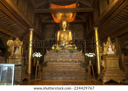 NYAUNGSHWE,MYANMAR-SEPT 30 : The golden sitting Buddha inside Church of Nyan Shwe Kgua temple on September 30,2014 in Nuaungshwe,Myanmar.This Temple is a famous school of Buddhist Monk in Myanmar.
