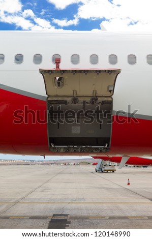 open cargo door on an airplane / empty cargo compartment