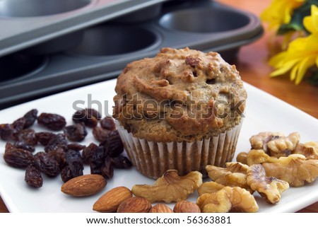 muffin with almond, raisin, walnut on white plate