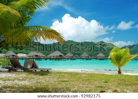 Relaxation with the beach , the palms and the lagoon in a luxury resort , Bora Bora , French Polynesia, South Pacific ocean