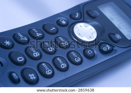 Close-up of phone keypad (shallow DOF, blue tint)