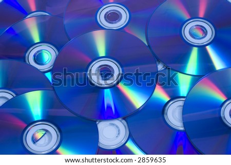 Blank CD/DVD disks background (blue tint)