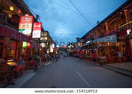 SIEM REAP, CAMBODIA - SEP 14: Pub Street at Night, Unidentified tourists walk along street where is the centre of night life, with restaurants and bars on Sep14, 2013 in Siem Reap, Cambodia.