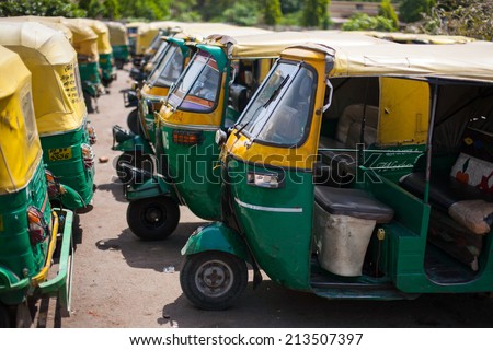 AGRA, INDIA - APRIL 12: Three wheel car which the public car transportation in call 'Auto Rickshaw' on Apr 12, 2014 in Agra, India.