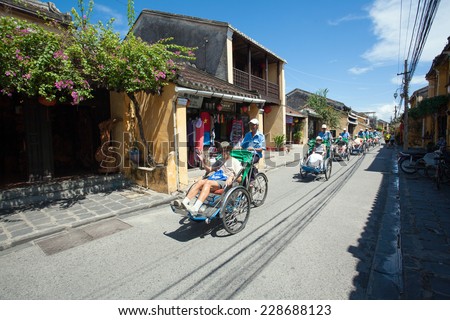 HOI AN, VIETNAM - OCTOBER 21: Pedicabs sight seeing city tour for traveller on the street in old town at UNESCO World Heritage on Oct 21, 2014 in Hoi An, Vietnam.