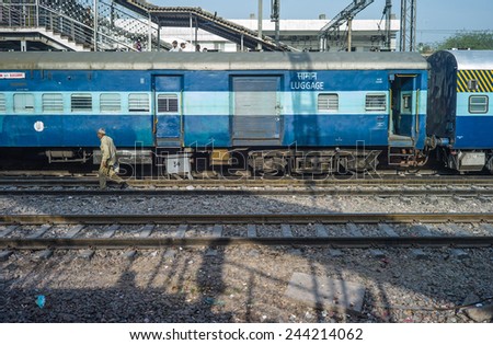 NEW DELHI, INDIA - APRIL 12: Unidentified indian peoples waiting for the train at old railway station, largest railway station. It handles over 350 trains and 500,000 passengers daily on Apr 12, 2014.
