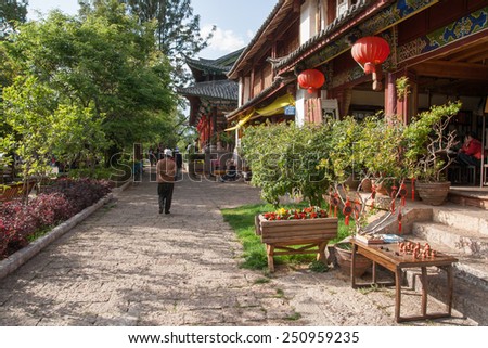 LIJIANG, CHINA - APRIL 12: Unidentified peoples visit Old town of Lijiang, It\'s a mainly non-Han town with a traditional Nakhi culture of the majority ethnic group on April 12, 2009 in Lijiang, China.