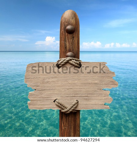 wood sign on the sea background