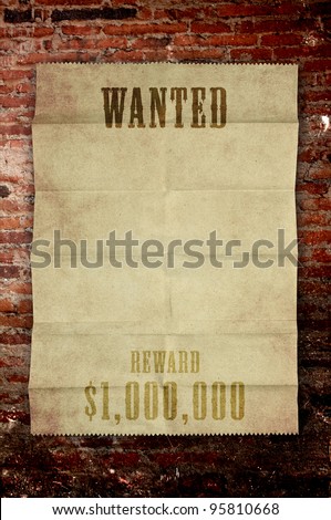 wanted paper poster on old brick wall
