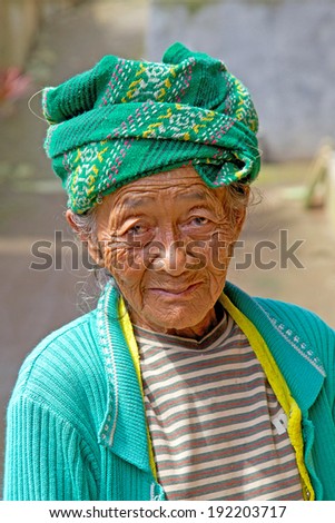 CENTRAL HIGHLANDS, BALI - JUNE 24, 2010: This elderly Balinese woman lives with her family in a small village in the Central Highlands of Bali.