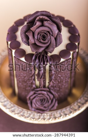 Beautiful wedding cake with chocolate rose design