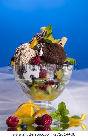 Ice cream balls in a cup decorated with fruits
