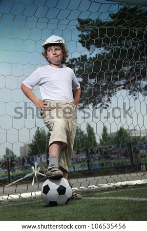 boy with ball in gate