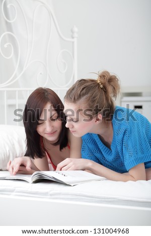 two beauty girl read magazine