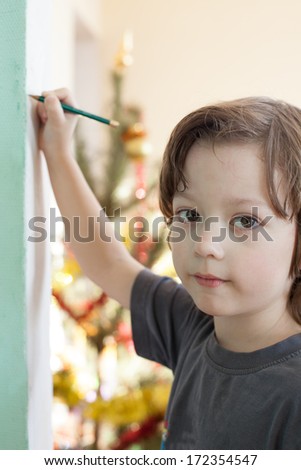 boy draw on wall
