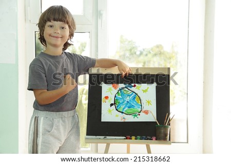 Children draw planet earth in home