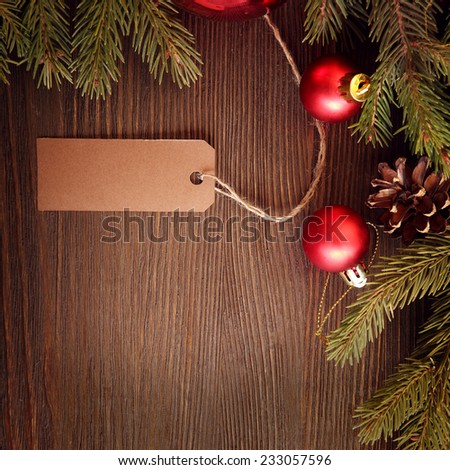Christmas Tree and decorations on wooden background paper for labels