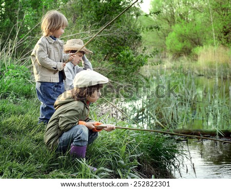 happy boys go fishing on the river