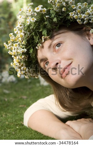 women on meadow with flower diadem