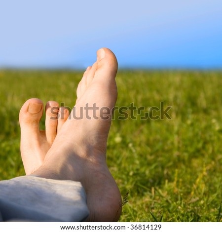 relaxed foot on grass