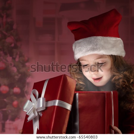 little girl open red gift box