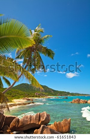 Dream seascape view with a big stones and palmtree, Seychelles, La Digue island