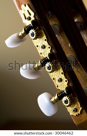 Closeup image of gold plated classical guitar tuners