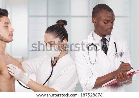 young doctors treat patient