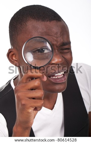 stock-photo-man-holding-magnifying-glass-looking-close-into-the-matter-large-eye-in-focus-80614528.jpg