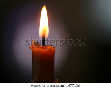candle in a dark colored background