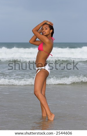 Caribbean bikini model wearing pink and white bikini