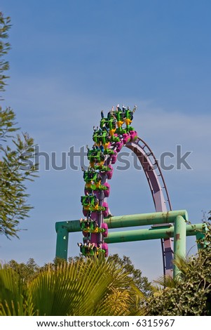 Rollercoaster loop against a brilliant blue sky